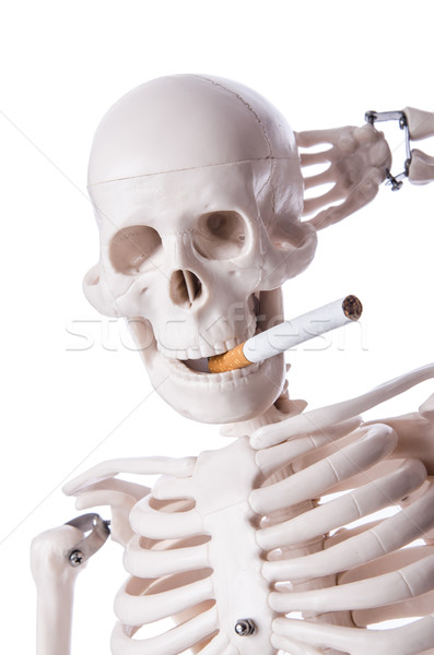 Skeleton smoking cigarette isolated on white Stock photo © Elnur