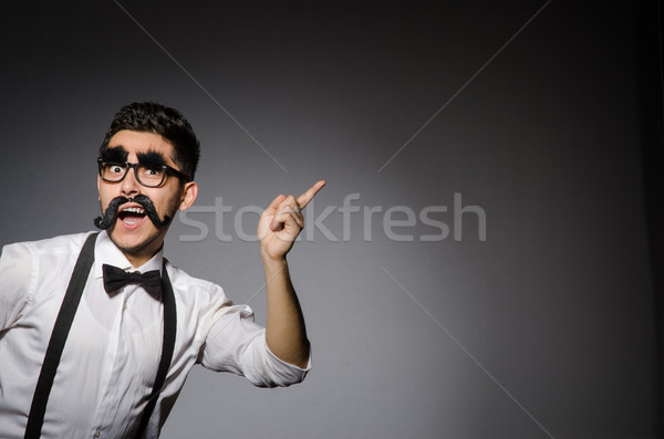 [[stock_photo]]: Jeunes · homme · faux · moustache · gris