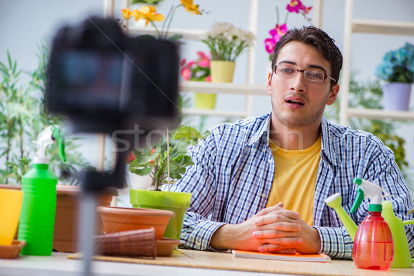 Man florist gardener vlogger blogger shooting video on camera Stock photo © Elnur