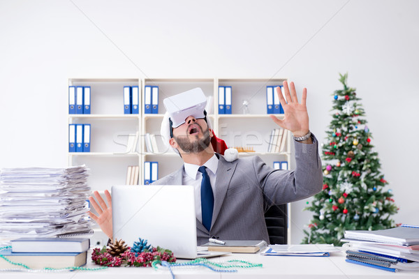 The young businessman celebrating christmas in the office Stock photo © Elnur