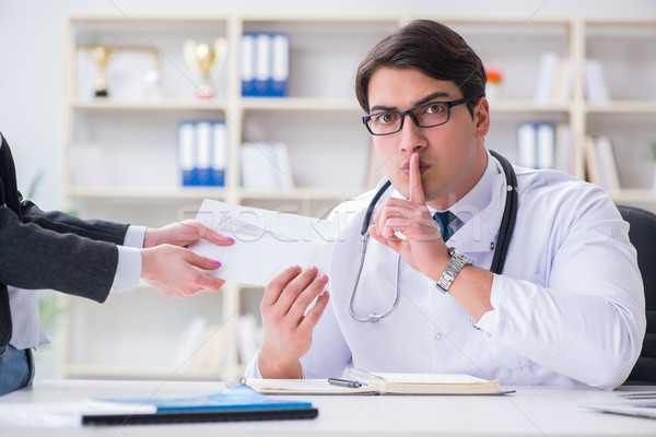 Young doctor in medical insurance fraud concept Stock photo © Elnur