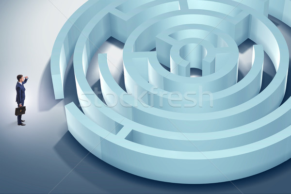 Businessman is trying to escape from maze labyrinth Stock photo © Elnur