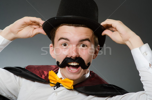 Grappig goochelaar hoed hand glimlach pak Stockfoto © Elnur