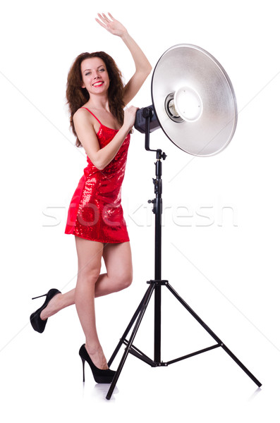 Stock photo: Woman in red dress posing in the studio