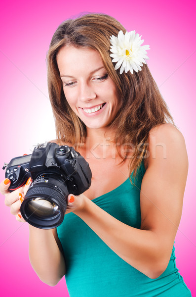 Attractive female photographer on white Stock photo © Elnur