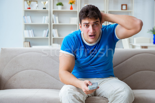 The man sweating excessively smelling bad at home Stock photo © Elnur