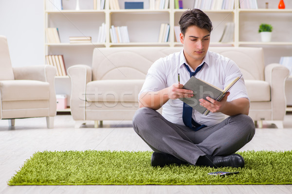 Businessman sitting on the floor in office Stock photo © Elnur