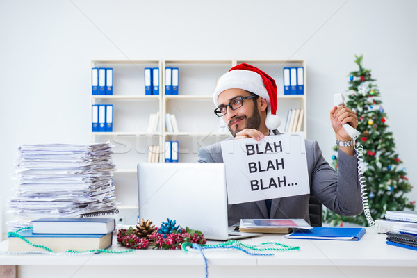 Young businessman celebrating christmas in the office Stock photo © Elnur