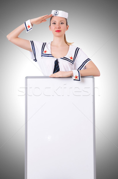 Stewardess with blank board on white Stock photo © Elnur