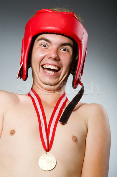 Stock photo: Funny boxer with winning gold medal