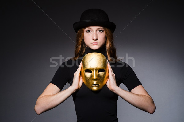 Redhead woman in hat  iwith mask in hypocrisy consept against gr Stock photo © Elnur
