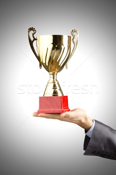 Man being awarded with golden cup Stock photo © Elnur