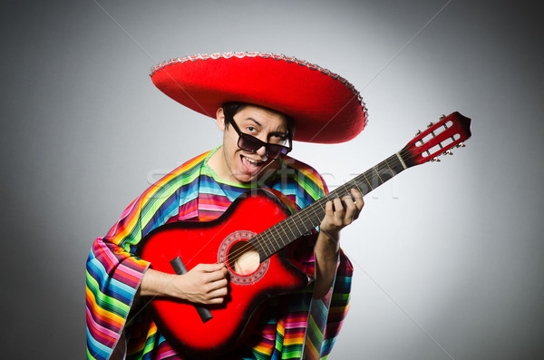 Man in red sombrero playing guitar Stock photo © Elnur