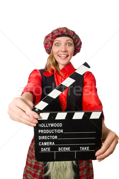 Stock photo: Funny woman in scottish clothing with movie board