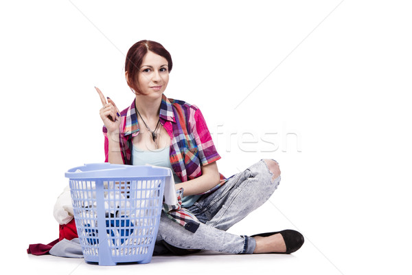 Woman tired after doing laundry isolated on white Stock photo © Elnur