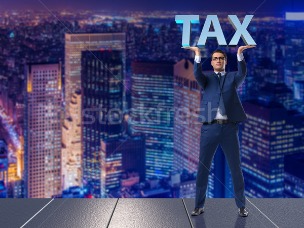 The man under the burden of tax payments Stock photo © Elnur