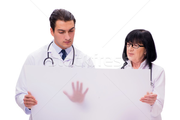 Two doctors isolated on the white background Stock photo © Elnur