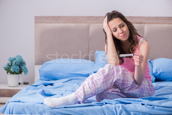 Stock photo: Woman with pregnancy results test