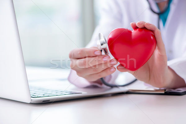 Doctor checking up heart in medical concept Stock photo © Elnur