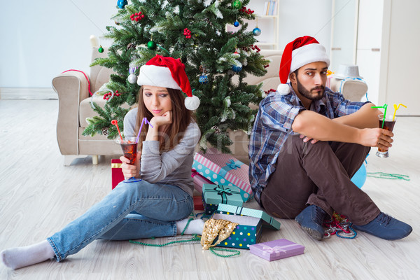 Stock photo: Young pair in conflict situation during christmas night