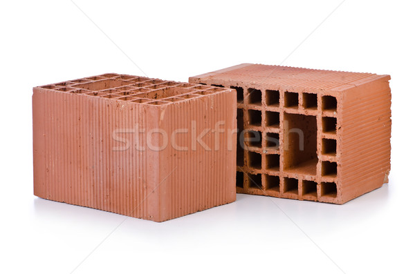 Stack of clay bricks isolated on white Stock photo © Elnur