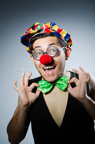 Funny clown against the dark background Stock photo © Elnur