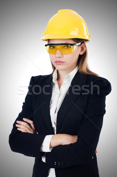 Young businesswoman with hard hat on white Stock photo © Elnur