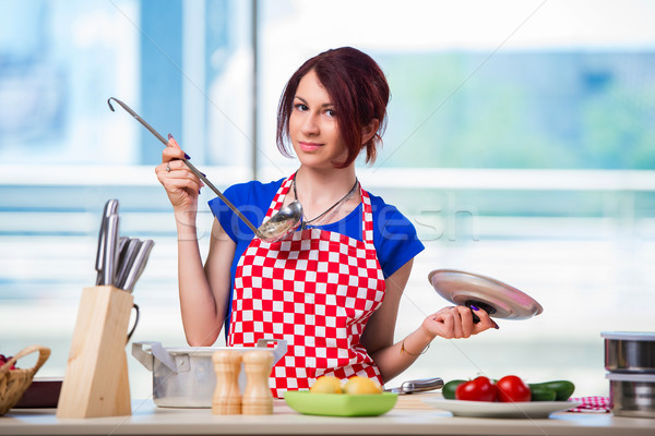 Woman preparing soup in the kitchen Stock photo © Elnur