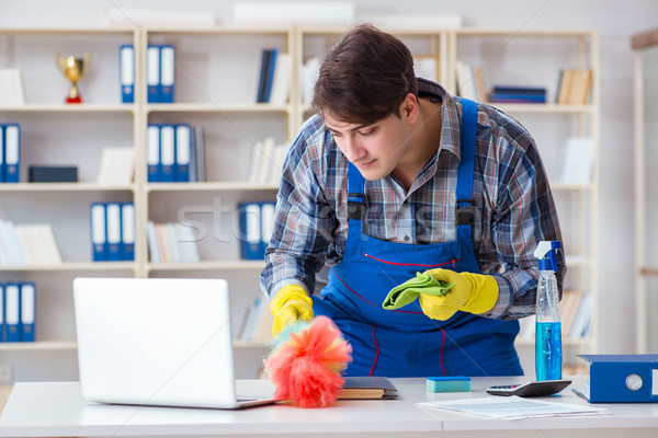 Stock photo: Male cleaner working in the office