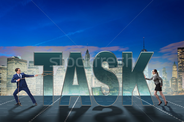 Stock photo: Businesswoman and businessman in task concept