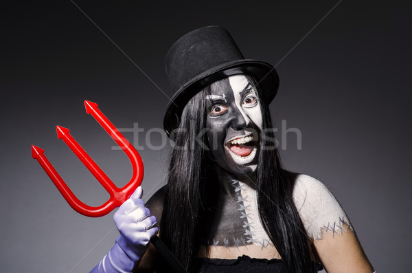 Satana woman with pitchfork and facemask Stock photo © Elnur
