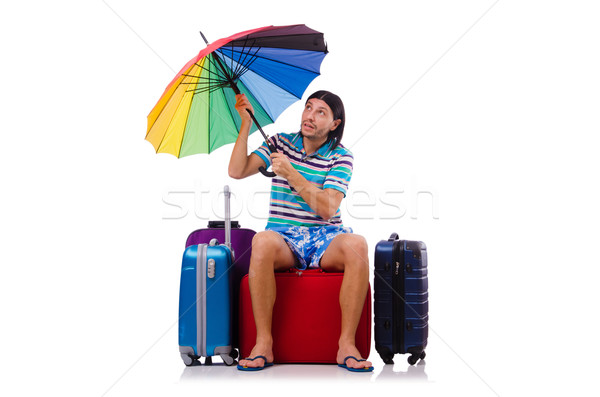 Traveler with cases and umbrella isolated on white Stock photo © Elnur