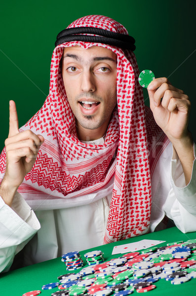 Arab férfi játszik kaszinó üzletember zöld Stock fotó © Elnur