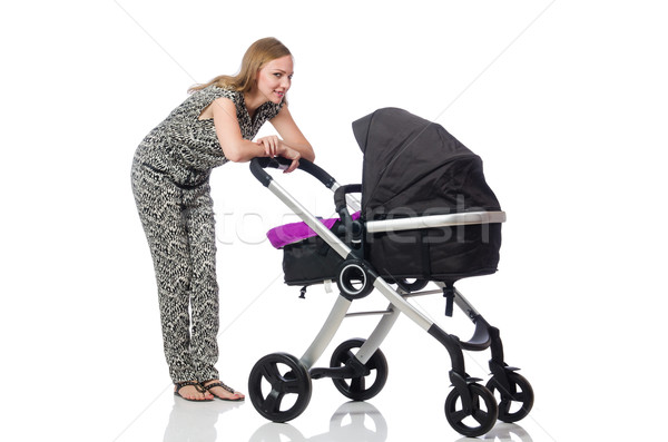 Stock photo: Happy mom with her baby in pram