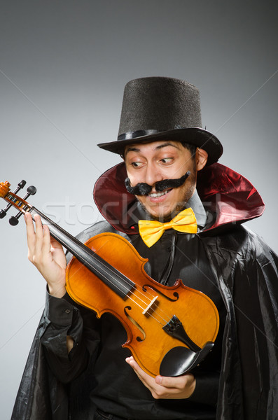 Funny violin player wearing tophat Stock photo © Elnur