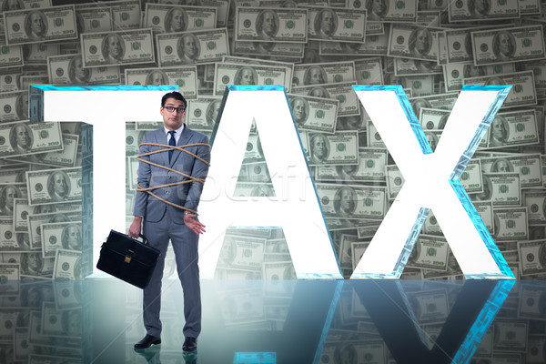 Businessman in tax burden business concept Stock photo © Elnur