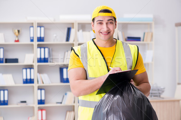 [[stock_photo]]: Homme · nettoyage · bureau · ordures · sac