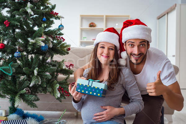 Young family expecting child baby celebrating christmas Stock photo © Elnur