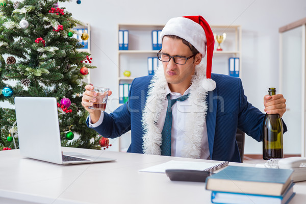 Businessman celebrating christmas holiday in the office Stock photo © Elnur