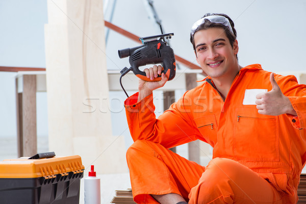 Beszállító dolgozik fapadló férfi boldog építkezés Stock fotó © Elnur