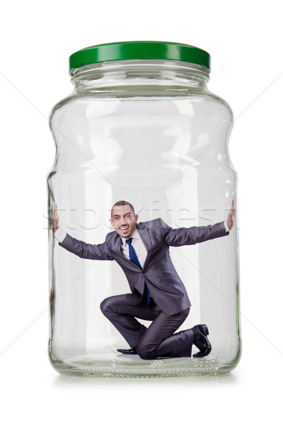 Young businessman in glass jar Stock photo © Elnur