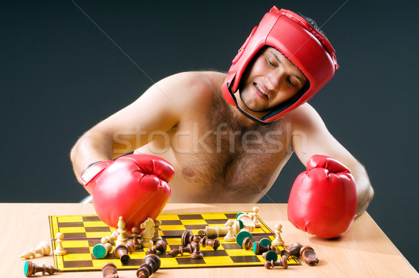 Boxer stuggling with chess game Stock photo © Elnur