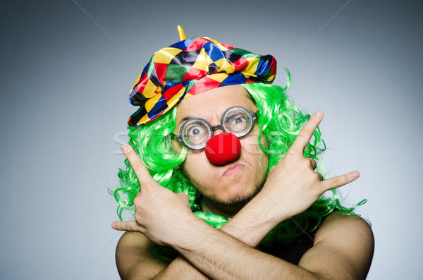 Funny clown against the dark background Stock photo © Elnur