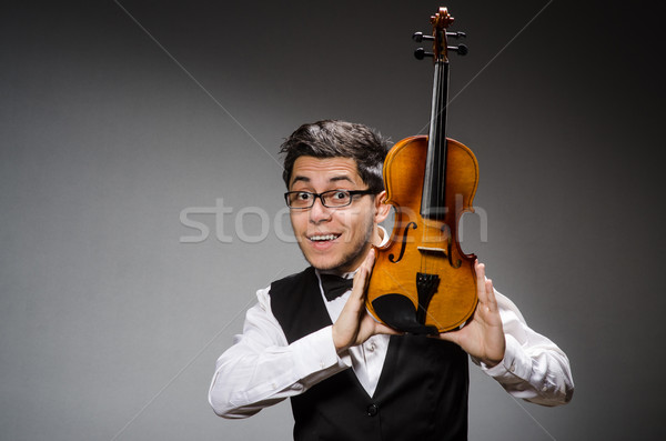 Stock photo: Funny violin player with fiddle