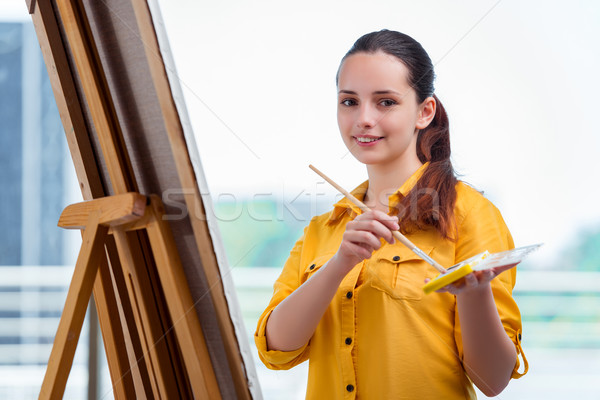 The young student artist drawing pictures in studio Stock photo © Elnur