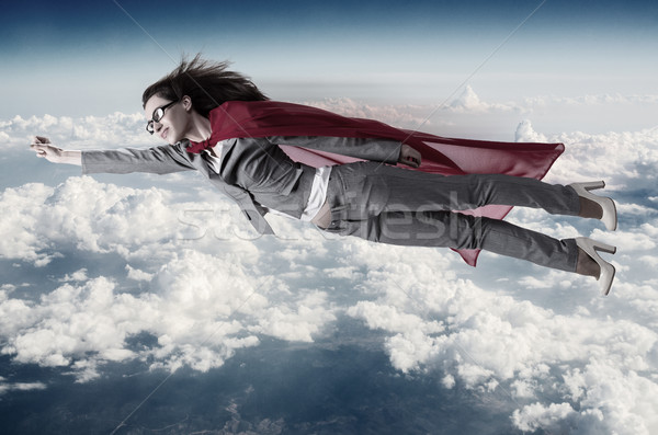 Superwoman flying above the skies Stock photo © Elnur