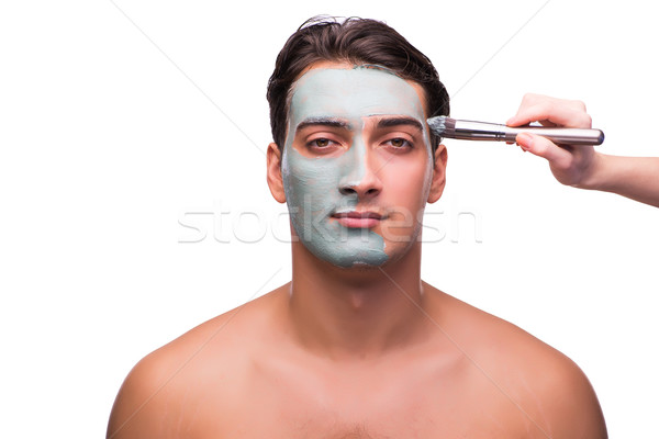 Man with face mask being applied on white Stock photo © Elnur