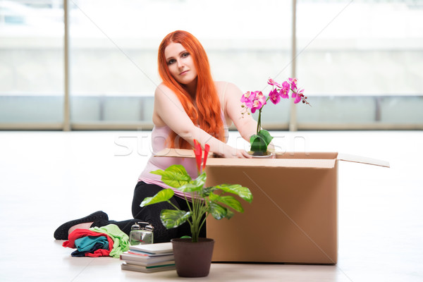 Young woman moving house in lifestyle concept Stock photo © Elnur