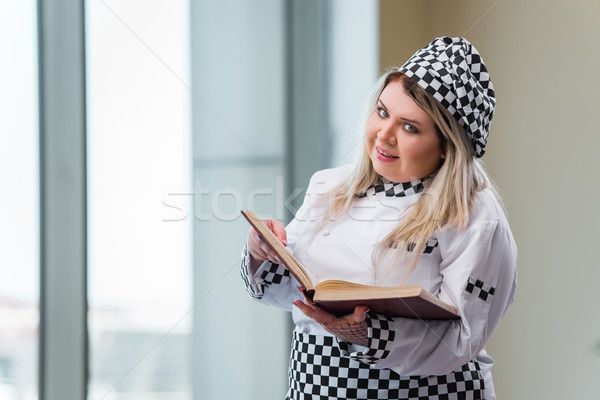Young chef cook working in the kitchen Stock photo © Elnur