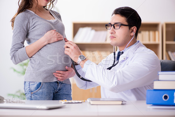 Mulher grávida médico consulta mulher mão homem Foto stock © Elnur